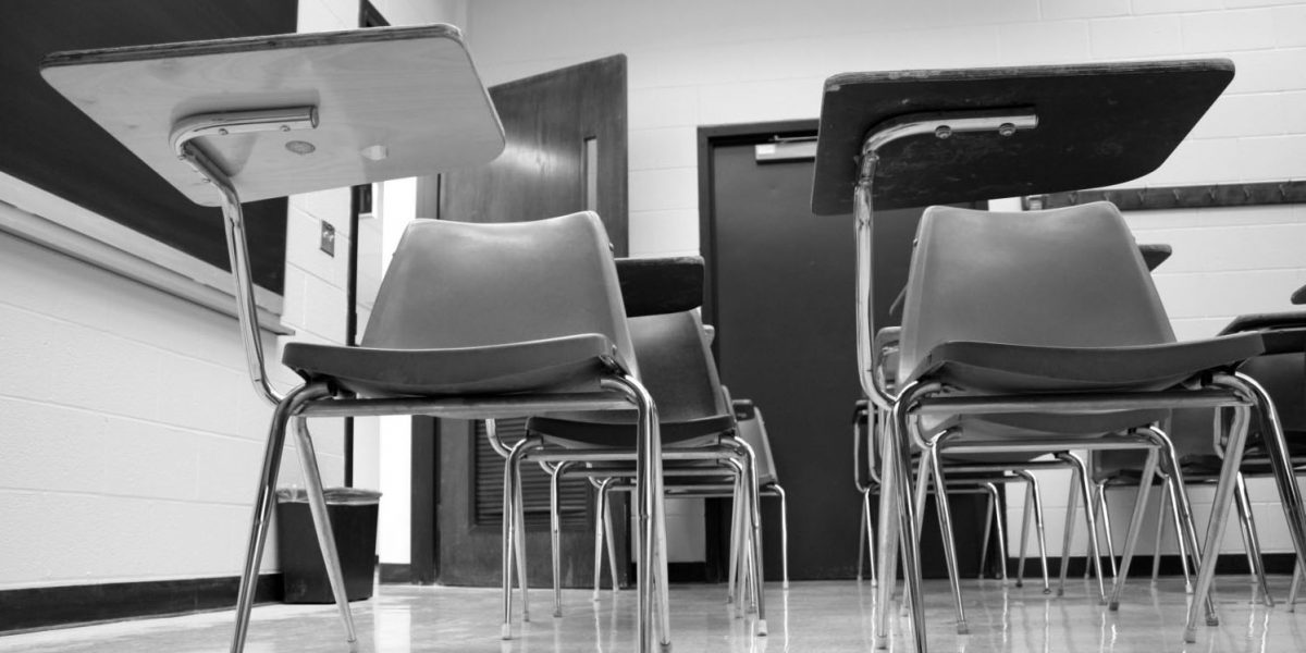 black and white photo of desks