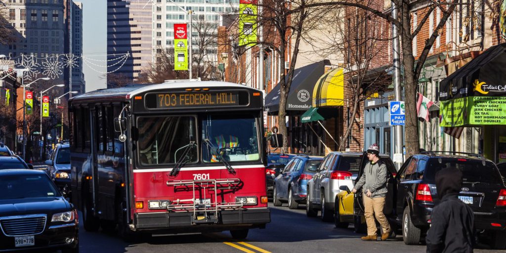 photo of bus coming down a street