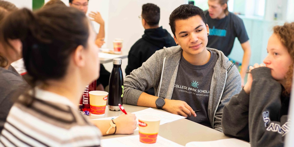 Photo of CP Scholars students sitting around a table