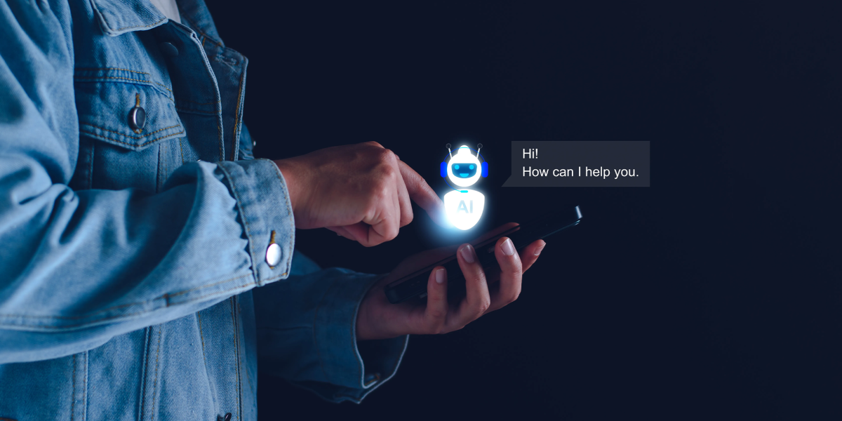 Person holding a smartphone interacts with an AI chatbot interface, shown as a glowing robot icon and message bubble on the screen.