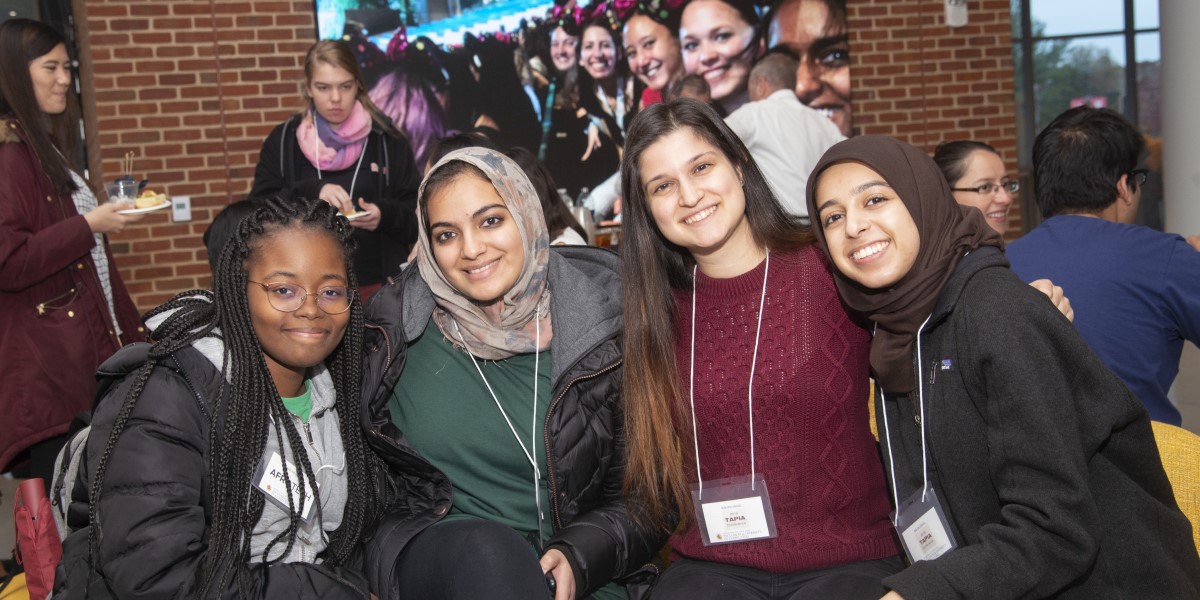 photo of 4 people smiling