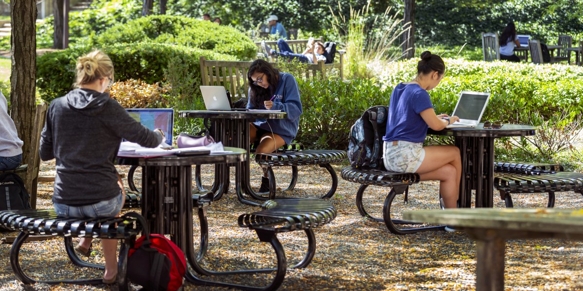 Students studying at tables in Hornbake Plaza