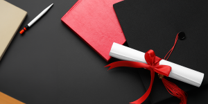 Scholarship materials on a black table.