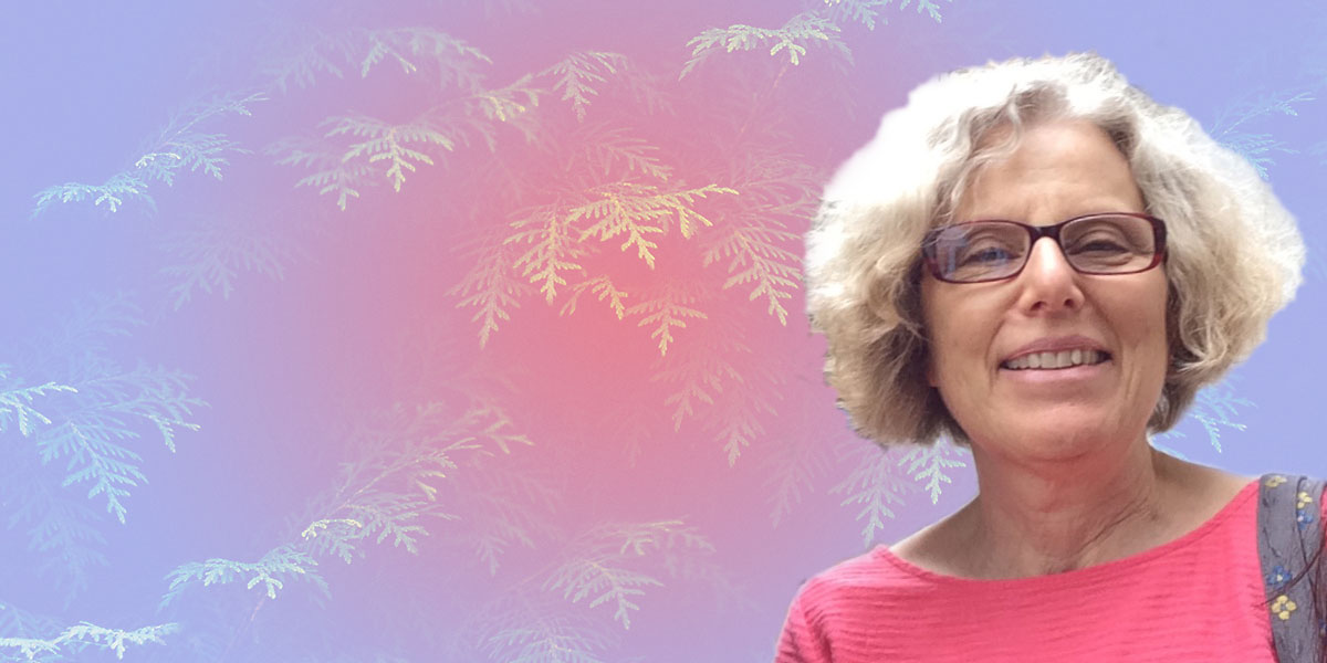 headshot of Wendy Simmons in front of a pink and purple background